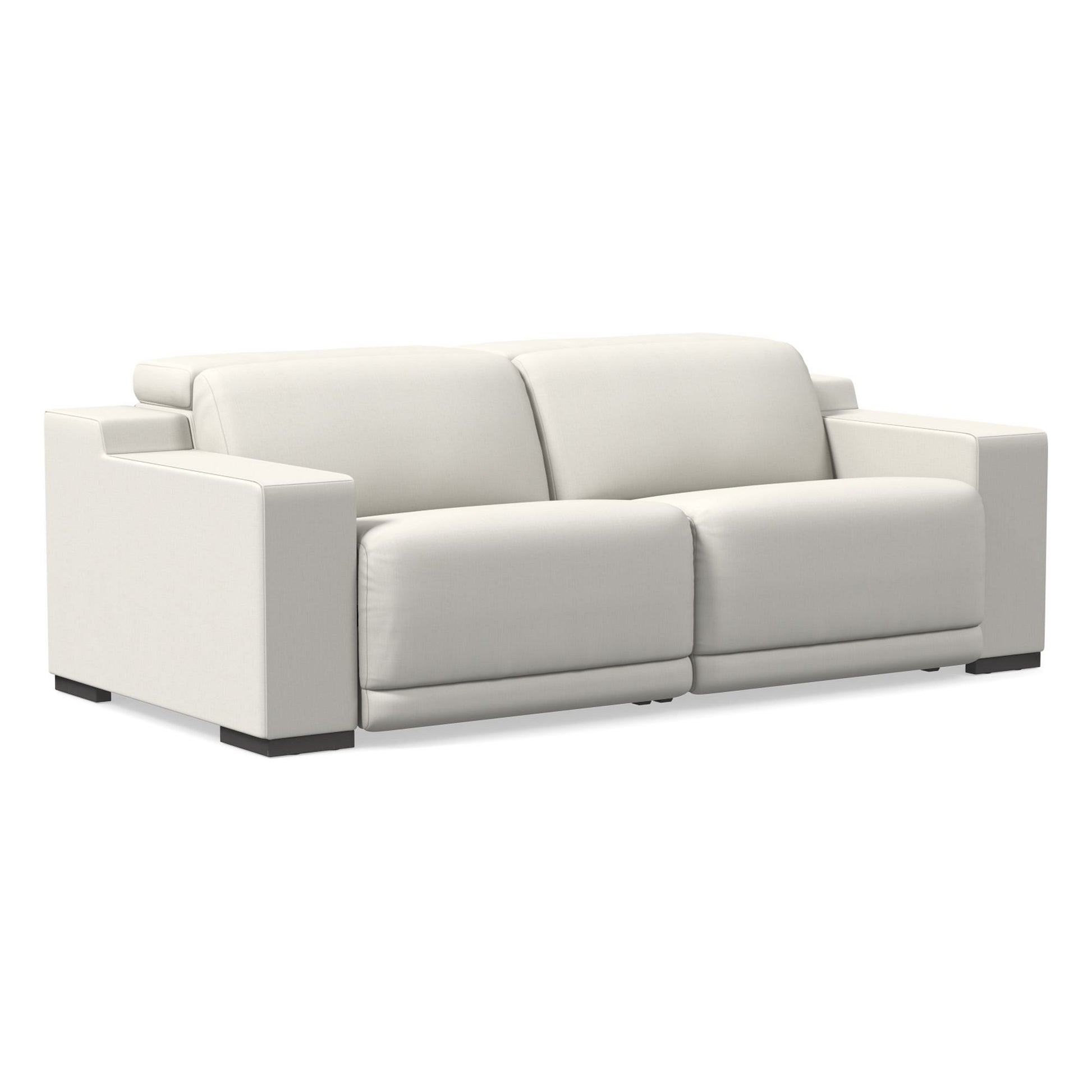 The Dalton Motion Sofa is a modern two-seater with square armrests and plush cushions, finished in white and set on dark block feet, displayed against a plain background.