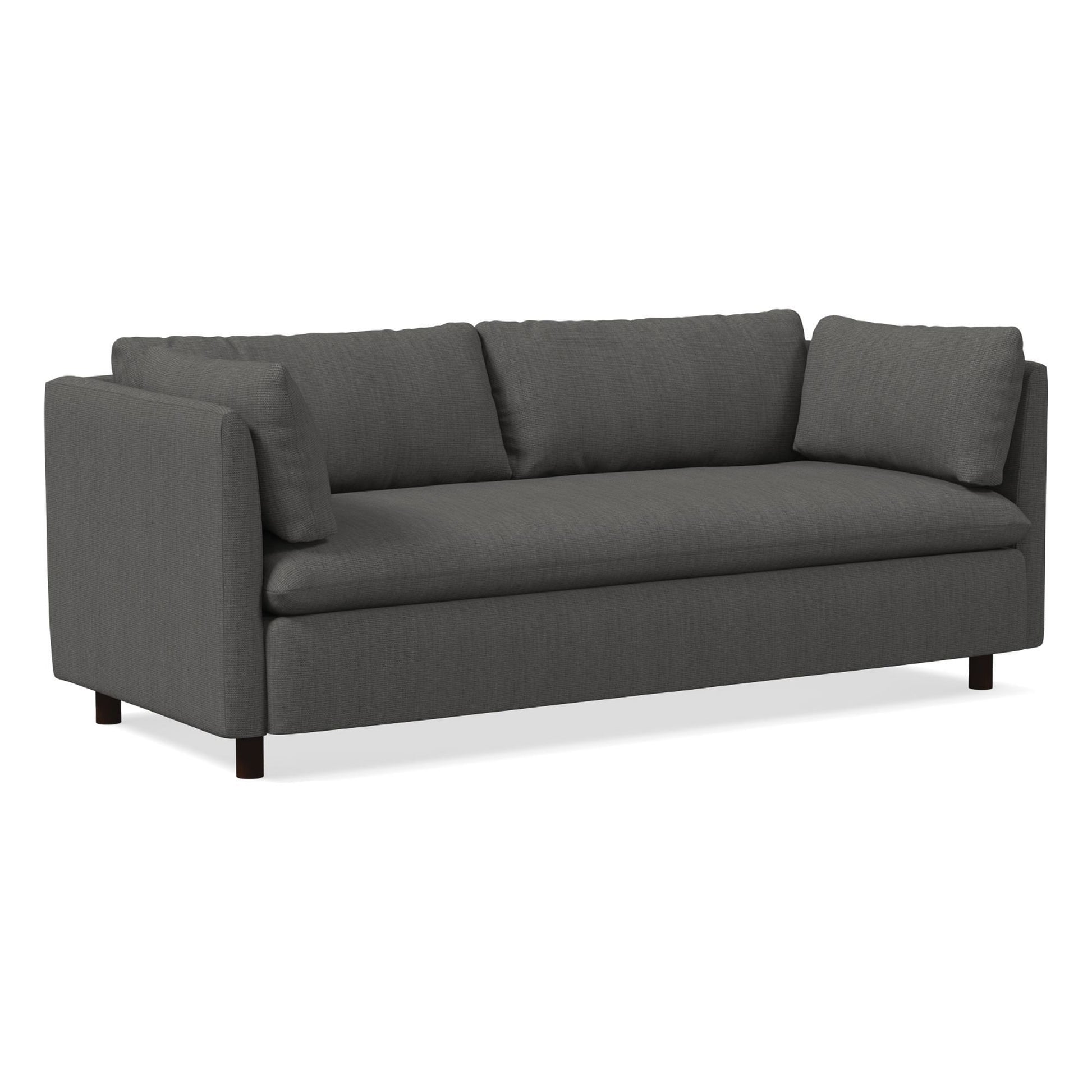 Introducing the Shelter Sleeper Sofa: a sleek, modern piece in dark gray featuring clean lines and three seat cushions. It comes with two rectangular back cushions and two side cushions, all supported by short black legs. Its minimalist design makes it an ideal fit for contemporary interiors.