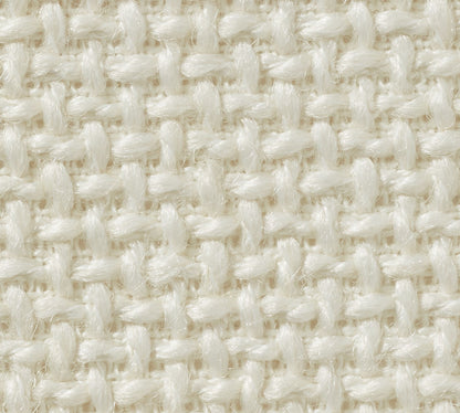 Close-up of the woven fabric on the York Slope Arm Deep Slipcovered Sofa, featuring a simple over-under pattern. The texture is soft and cream-colored, with tightly interlaced threads forming a uniform, grid-like appearance.