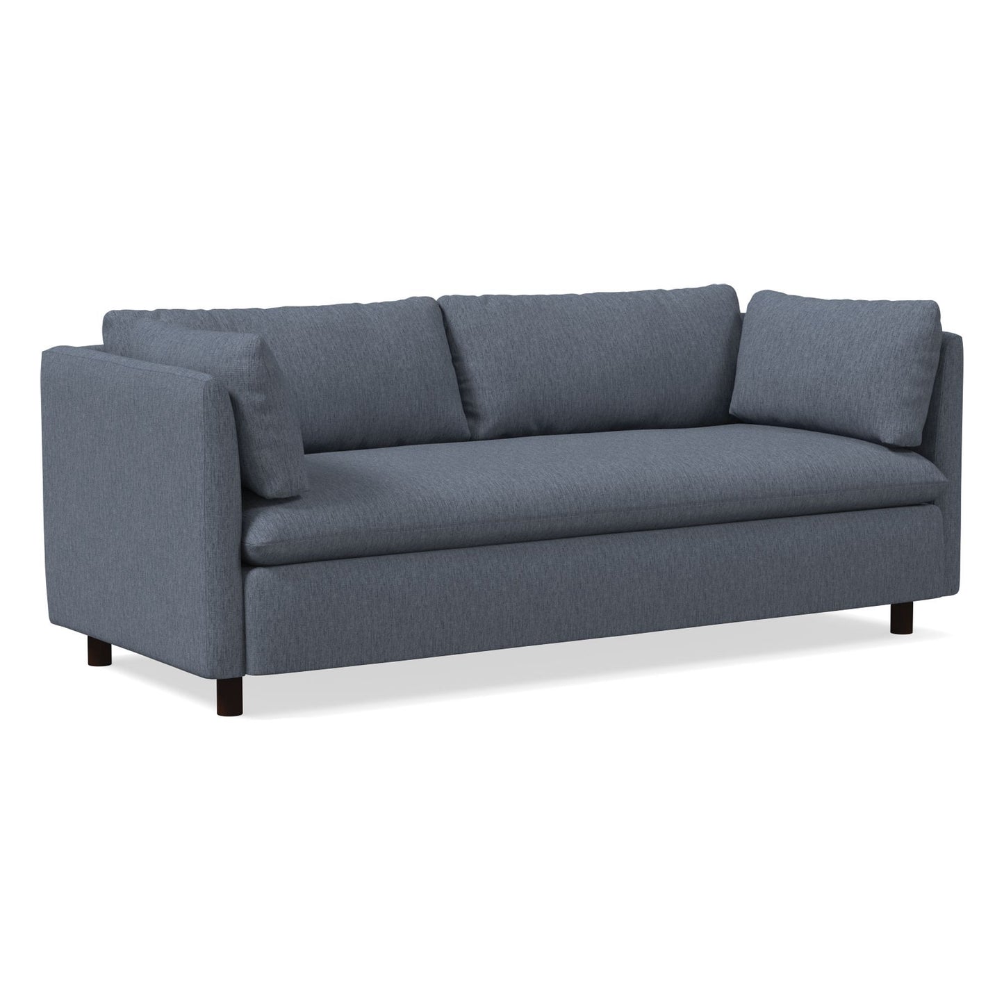 The Shelter Sleeper Sofa is a contemporary piece in a blue-gray hue, boasting three seat cushions and three back cushions with a minimalistic style. It features rectangular armrests and rests on short, dark wooden legs, set against a plain white backdrop.