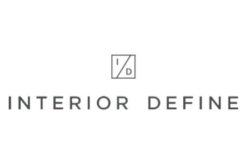 Logo of Interior Define. It features a minimalist design with the company's name in uppercase letters below a small square containing the initials "I" and "D" separated by a diagonal line. The logo is displayed in a gray color on a white background.