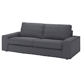 The KIVIK Sofa is a dark gray piece featuring two large seat cushions and two back cushions. It has wide armrests and a simple, modern design, making it ideal for contemporary living spaces. The sofa looks plush and comfortable.