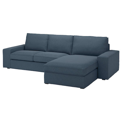 The KIVIK Sofa with Chaise is a blue L-shaped sectional featuring three back cushions, a chaise lounge on the right side, wide armrests, and a contemporary design.