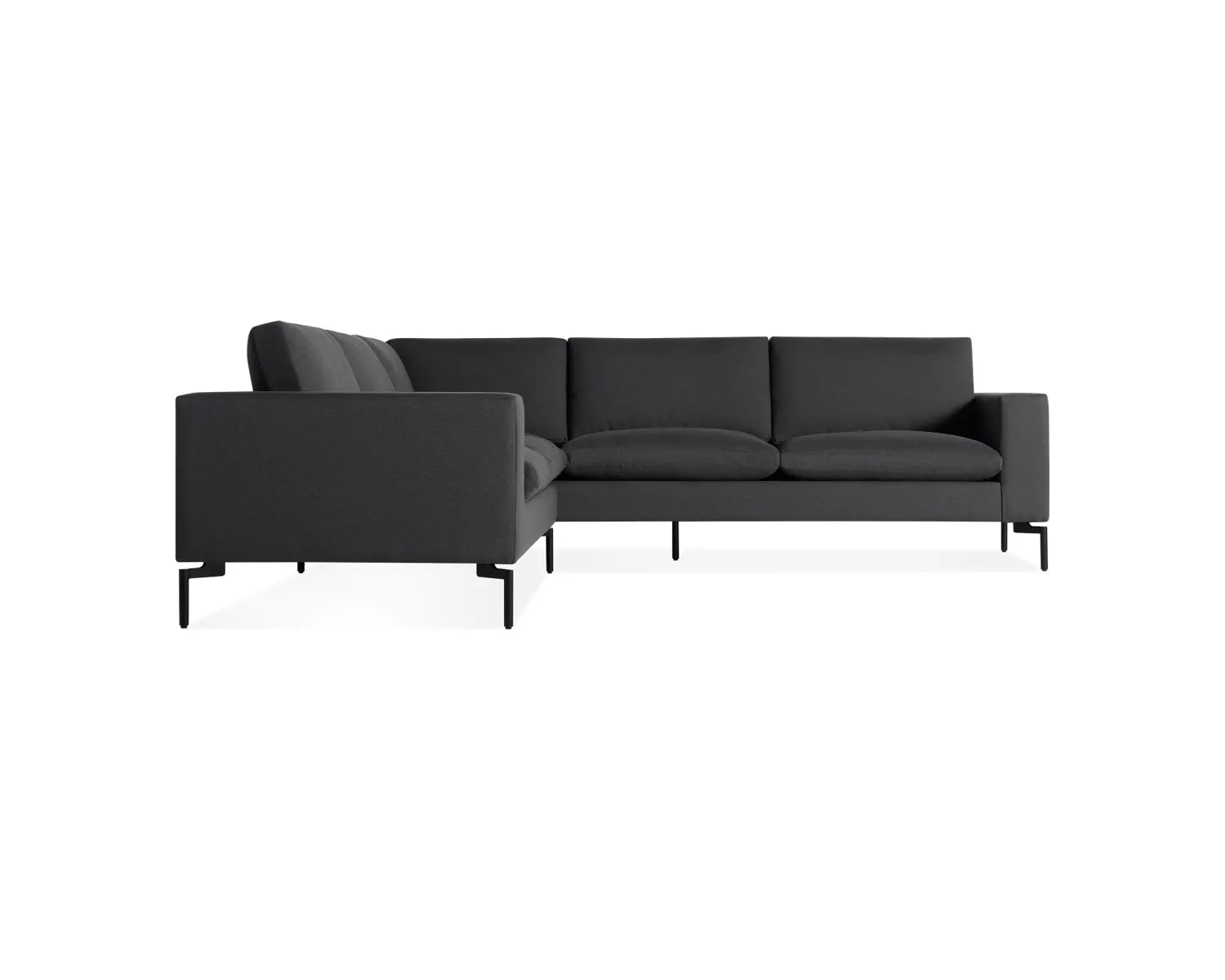 Introducing the New Standard Sofa Sectional, a sleek and contemporary dark gray sectional sofa designed with clean lines and a minimalist aesthetic. It features a right-angle configuration, metal legs, and plush cushions set on a white background, offering a modern and stylish seating solution.