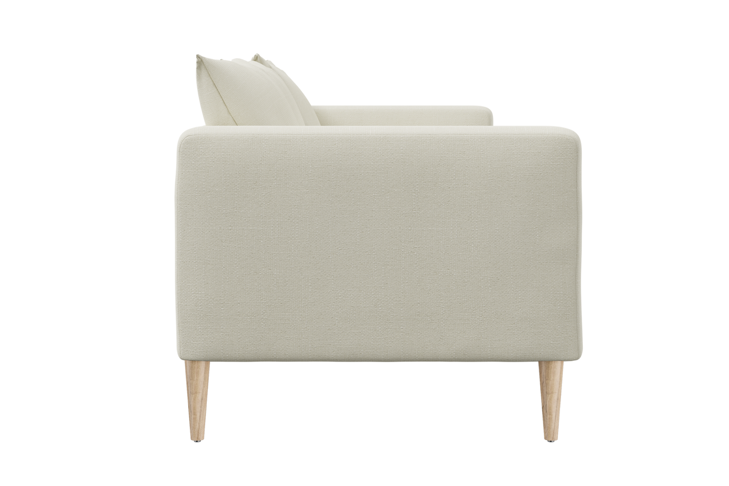 Side view of The Essential Loveseat, a minimalist beige sofa with light wood legs, featuring plush cushions. Its sleek and modern design showcases a clean and simple aesthetic.