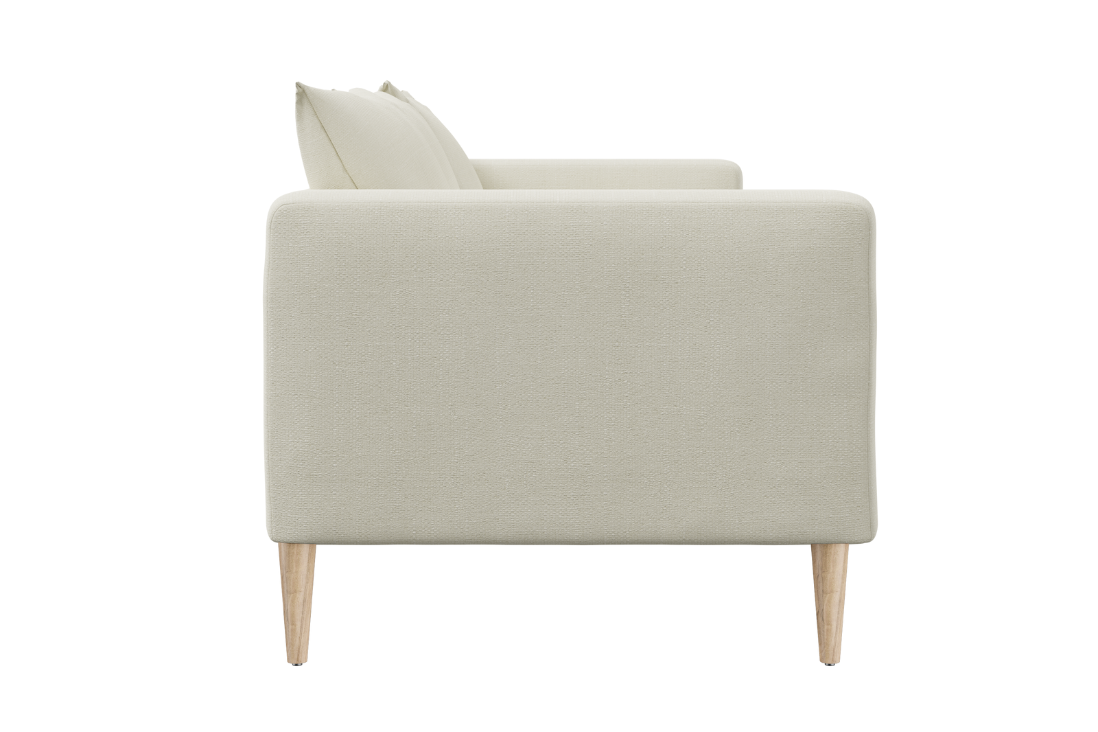 Side view of The Essential Loveseat, a minimalist beige sofa with light wood legs, featuring plush cushions. Its sleek and modern design showcases a clean and simple aesthetic.