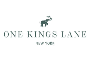 A minimalist logo with an elephant carrying a pennant above the text "One Kings Lane." Below, the location "New York" is written in smaller font. The design is simple, using a dark green color on a white background.