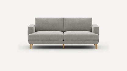 An Ember Mid-Century Modern 75" Sofa in gray, featuring clean lines and wooden legs, set against a plain white background.