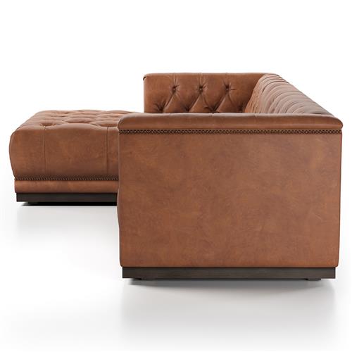 The Emmy Rustic Warm Brown Leather Sectional Left Arm Facing features an L-shaped design with tufted cushions on both the seat and backrest, beautifully displayed against a white background.