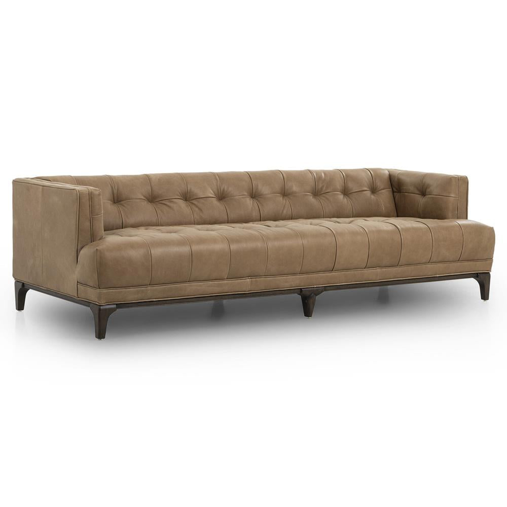 A contemporary, button-tufted green velvet sofa with a low back and sleek design, featuring three seat cushions and resting on dark brown wooden legs. The Allen Mid Century sofa is set against a plain white background.