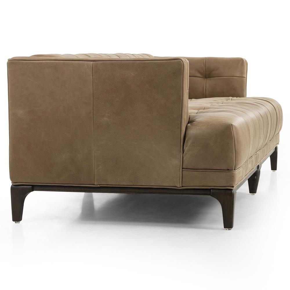 The Allen Mid Century Green Velvet Sofa boasts a brown wood frame with button tufted cushions, high sides, and slightly angled design. Its modern style and sleek finish are prominently displayed against a white background.