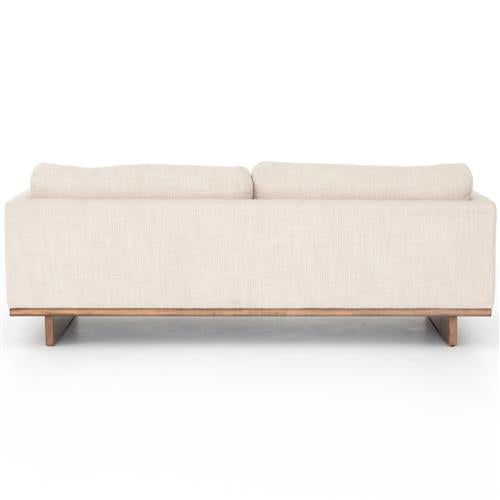 Rear view of the Ethan Modern Classic Cream Performance Cushion Back Sofa featuring a minimalist design. It includes two large back cushions and a wooden base, and is displayed against a plain white background.