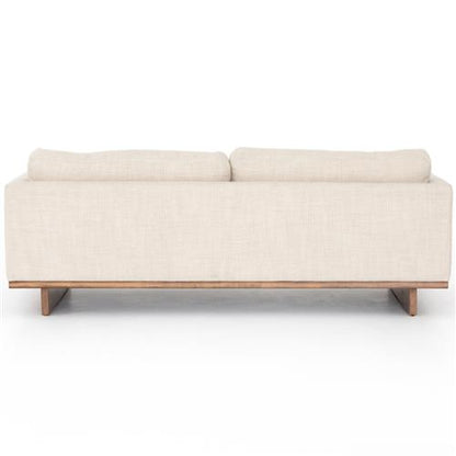 Rear view of the Ethan Modern Classic Cream Performance Cushion Back Sofa featuring a minimalist design. It includes two large back cushions and a wooden base, and is displayed against a plain white background.