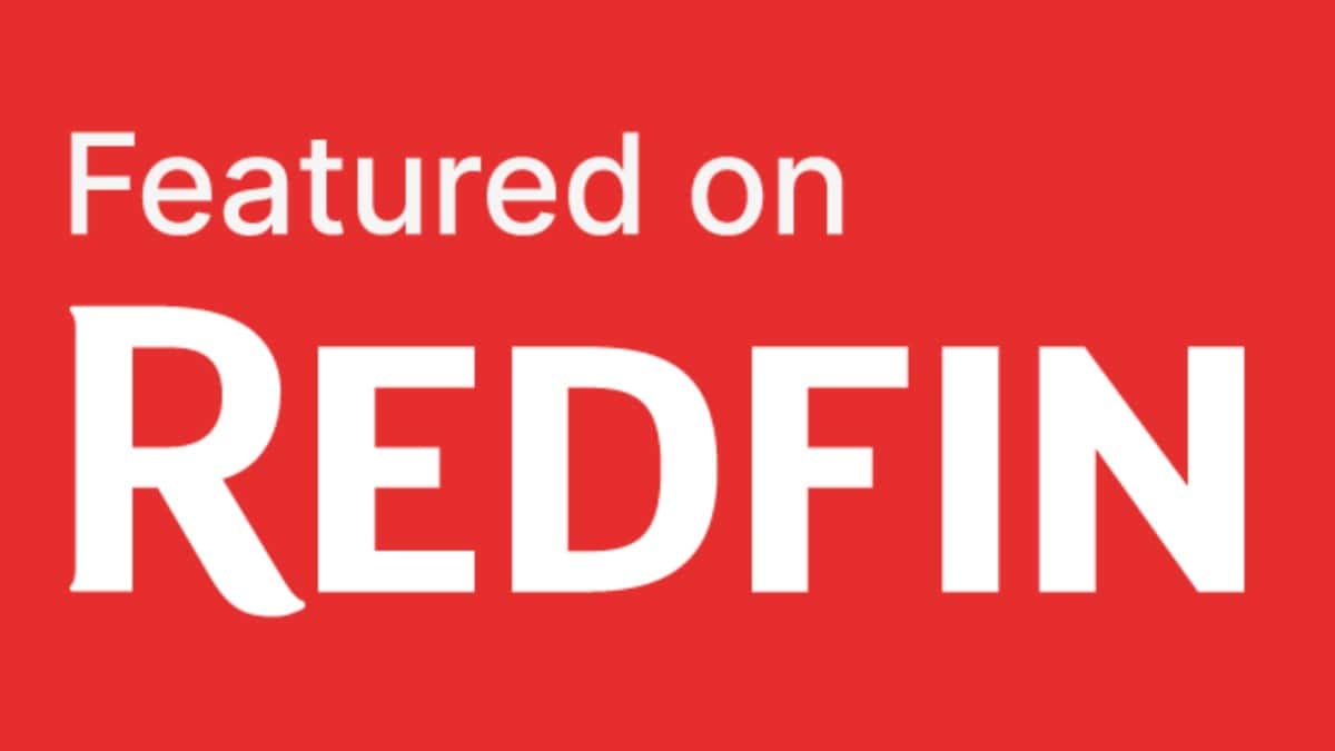 A red rectangle with white text that reads "Featured on Redfin." The word "Redfin" is in larger, bold letters.