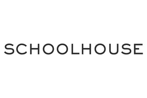 The image shows the word "SCHOOLHOUSE" written in black, capitalized letters against a plain white background. The font is clean and simple. There are no other elements in the image.