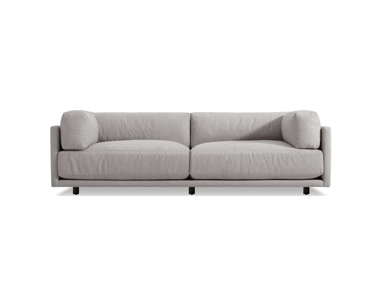 Centered against a white background is the Sunday 102-Inch Sofa, characterized by its modern and minimalist design in grey, featuring two large cushions and straight armrests. This sofa emphasizes clean lines and comfort.