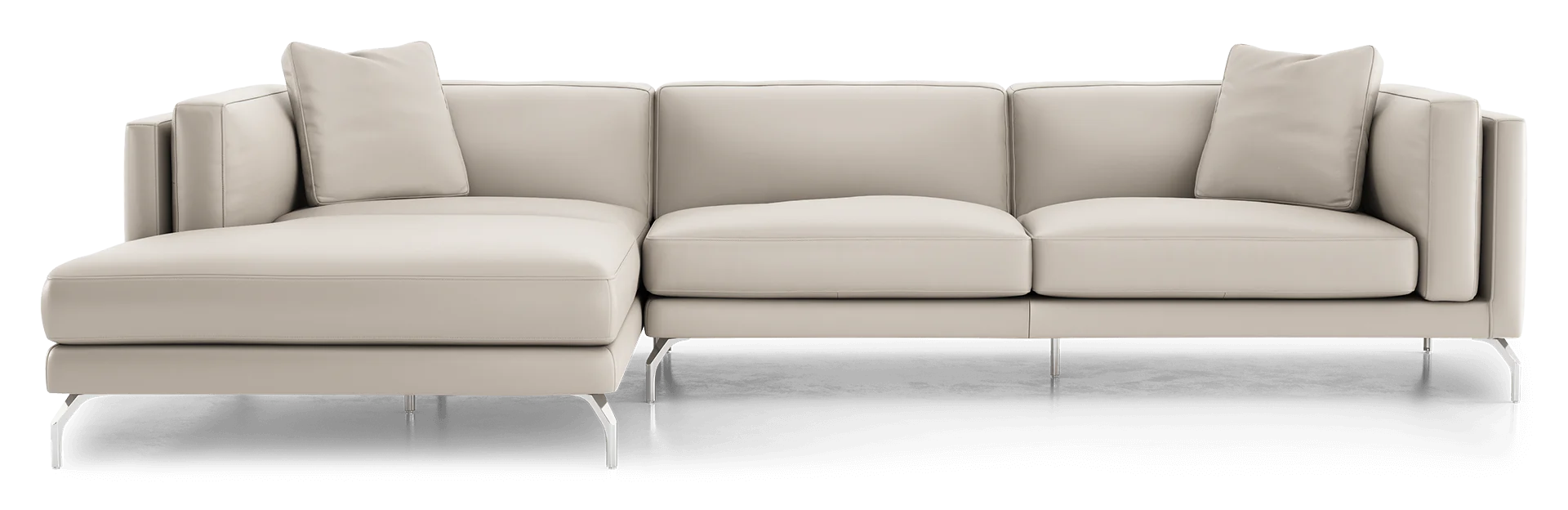 The Reade Sectional Sofa is a contemporary beige piece featuring sleek lines, metal legs, and three cushions. The chaise lounge extends to the left, offering a spacious seating arrangement.