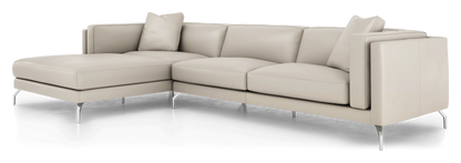 Introducing the Reade Sectional Sofa: a modern beige L-shaped sectional featuring sleek metal legs and plush cushions. Accentuated by two square throw pillows at the corners, it embodies a contemporary design.