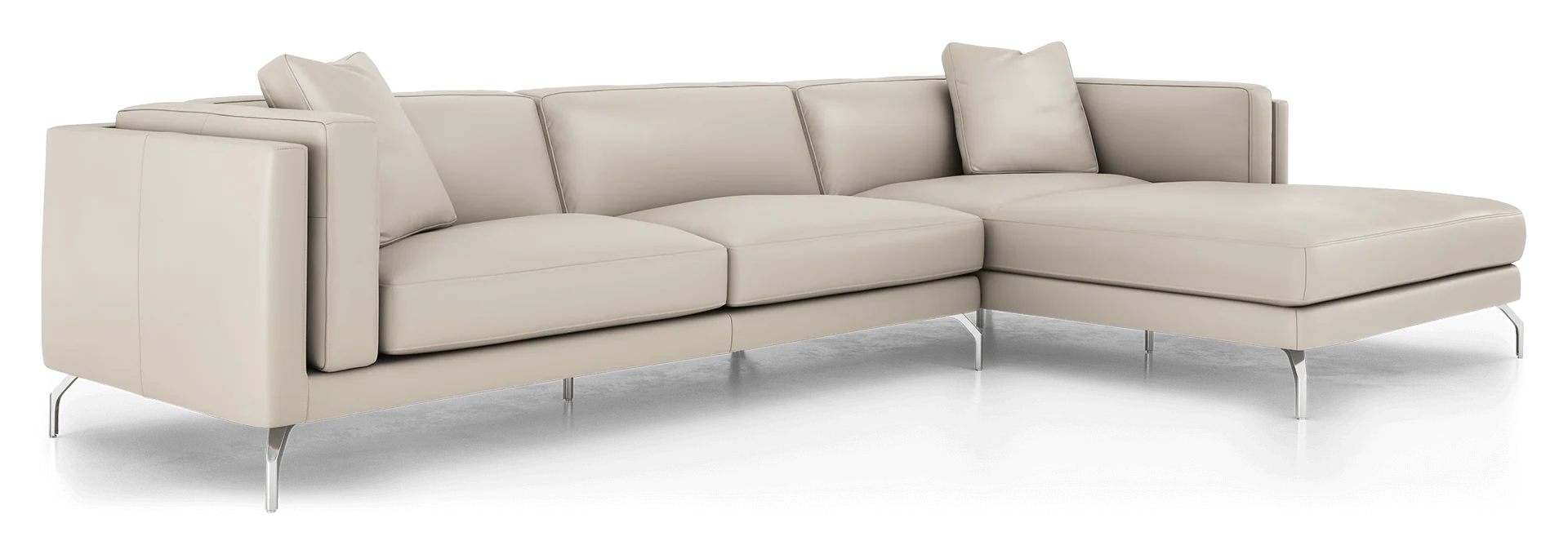 Introducing the Reade Sectional Sofa: a contemporary L-shaped design crafted in light beige leather. It showcases sleek, minimalist lines with chrome legs, and is complemented by matching back cushions and a pillow.