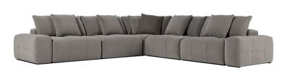 The Fullerton Modular Sofa 04 is a large, gray sectional sofa that offers plush cushions. It is configured in an L-shape and showcases a modern, minimalistic design with deep seating and broad armrests.