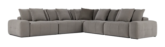 The Fullerton Modular Sofa 04 is a large, gray sectional sofa that offers plush cushions. It is configured in an L-shape and showcases a modern, minimalistic design with deep seating and broad armrests.