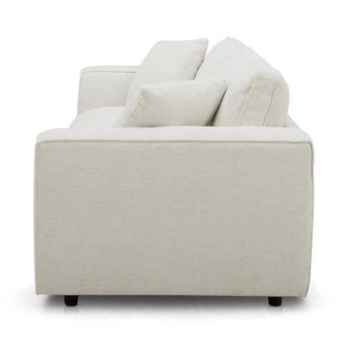 Side view of the Elmore Sofa, a modern beige piece with clean lines and two cushion accents. This sofa features a minimalist design and plush seating.