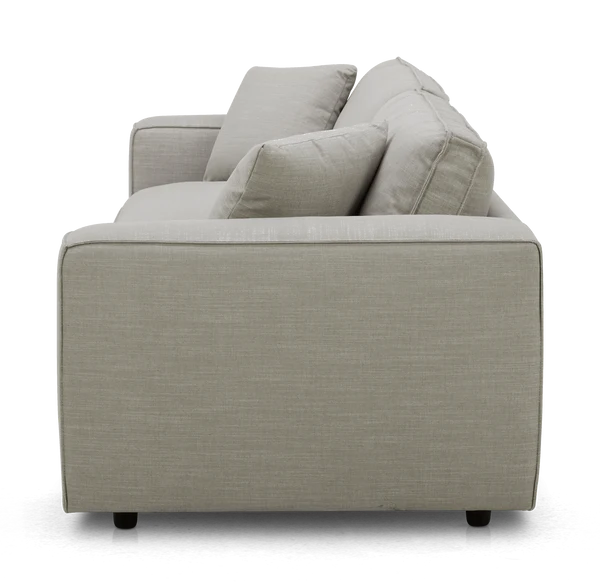 Side view of the Elmore Sofa in light gray fabric, featuring two seat cushions and two back cushions. The modern design rests on low, dark feet.