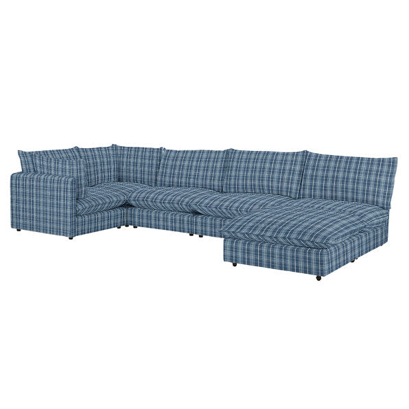 Introducing the Keaton 6 Piece Modular U Shaped Sectional, a spacious blue plaid sofa with a modern design, complete with multiple cushions and an L-shaped configuration.