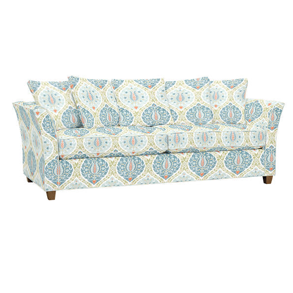 The Tate Queen Sleeper features a floral and geometric patterned design in light blue, teal, orange, and white, complete with square arms, three seat cushions, and several matching throw pillows that showcase the same intricate pattern.