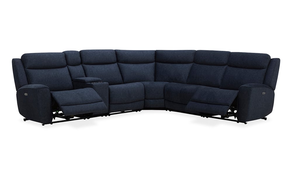 The Palmeri Denim Power 6-Piece Sectional is a dark blue, L-shaped sectional sofa featuring reclining seats on each end. Its plush fabric provides a comfortable and spacious seating option, and the design includes a center console with cup holders.