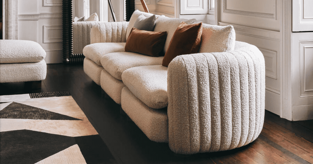 sleek boucle couch in cream color