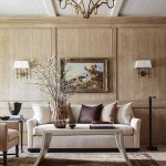 Centsational Style lifestyle and home decor and interior design blog. Modern living room with natural wood paneled walls, painted white exposed beam ceiling with painted panels, gold wall sconces, white upholstered sofa with flared arms, gold chandelier, distressed aged gray wood coffee table