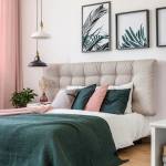 Fresh Design Blog lifestyle and home decor and interior design blog. Modern bedroom with gray, button tufted headboard, evergreen blanket and pillows, pink curtains, black and white multi tier pendant lamps, plant artwork.